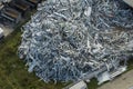 Aerial view of large pile of scrap aluminum metal from broken houses after hurricane Ian swept through Florida. Recycle