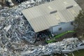 Aerial view of large pile of scrap aluminum metal from broken houses after hurricane Ian swept through Florida. Recycle