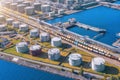 Aerial view large port oil loading terminal with large storage tanks. Railway infrastructure for the delivery of bulk cargo by sea Royalty Free Stock Photo