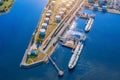 Aerial view large port oil loading terminal with large storage tanks. Railway infrastructure for the delivery of bulk cargo by sea Royalty Free Stock Photo