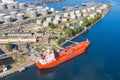 Aerial view large port oil loading terminal with large storage tanks. Railway infrastructure for the delivery of bulk cargo by sea Royalty Free Stock Photo