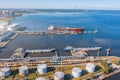 Aerial view large port oil loading terminal with large storage tanks. Railway infrastructure for the delivery of bulk cargo by sea Royalty Free Stock Photo