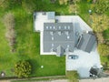 Aerial view of a large, recently built house which was built onto a previous bungalow.