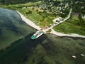 Aerial view of a large vessel docked in a port, with a body of water in the background Royalty Free Stock Photo