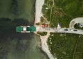 Aerial view of a large vessel docked in a port, with a body of water in the background Royalty Free Stock Photo