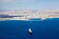 Aerial view at Larnaca city and Main Harbor in Cyprus island. Dry-cargo freighter coming from port Royalty Free Stock Photo