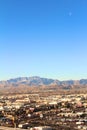 Aerial view of the Las Vegas with mountains and plane and moon at day