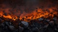 Aerial view of a lava flow with interspersed rocks showing the boundary between solid and molten material on a dark background Royalty Free Stock Photo