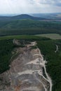 Aerial view of layers of upper part of open-cast stone quarry mine Royalty Free Stock Photo