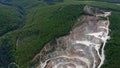 Aerial view of layers of upper part of open-cast stone quarry mine Royalty Free Stock Photo