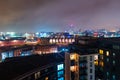 Aerial view of Leeds docks, England, UK during the night. Heavy clouds over the modern buildings Royalty Free Stock Photo