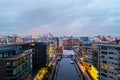 Aerial view of Leeds docks, England, UK during the sunset. Heavy clouds