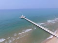 Aerial view of light house pier bridge into blue sea Royalty Free Stock Photo