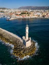 Aerial view of a lighthouse and the old Venetian harbor in the Greek town of Chania on the island of Crete Royalty Free Stock Photo