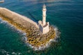 Aerial view of a lighthouse and the old Venetian harbor in the Greek town of Chania on the island of Crete Royalty Free Stock Photo