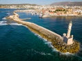 Aerial view of a lighthouse and the old Venetian harbor in the Greek town of Chania on the island of Crete Royalty Free Stock Photo