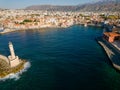 Aerial view of a lighthouse and the old Venetian harbor in the Greek town of Chania on the island of Crete Royalty Free Stock Photo