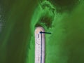 Aerial view of the lighthouse surrounded by algal bloom Royalty Free Stock Photo
