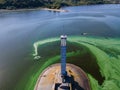 Aerial view of the lighthouse surrounded by algal bloom Royalty Free Stock Photo