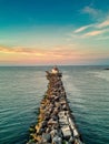 Aerial view of lighthouse surrounded by water in  Ashtabula during sunset Royalty Free Stock Photo