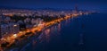 Aerial view of Limassol promenade or embankment with alley and buildings in Cyprus at night. Drone photo of