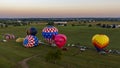 Aerial View of a Line of Hot Air Balloons Getting Ready for an Early Morning Launch