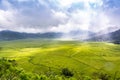 Aerial View of Lingko Spider Web Rice Fields While Sunlight Piercing Through Clouds to the Field Royalty Free Stock Photo