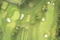 Aerial view of links golf course during summer showing green and bunkers at driving range Royalty Free Stock Photo