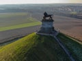 Aerial view of The Lion`s Mound with farmland around.