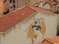 Aerial view on Lisbon house, with tileed roof and graffiti on the wall