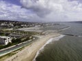 Aerial view of Lisbon southern coastline following Tagus river with April 25th bridge in background, view of the city skyline, Royalty Free Stock Photo