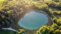 Aerial view of a little lake and trees surrounding, in italian Appennini hills Royalty Free Stock Photo