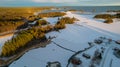 Aerial view of little Swedish village with islands and forests on a Baltic sea coast at winter time. Drone photography - winter in