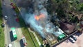 Aerial view of a live fire training exercise with a fully involved house. 4K footage from drone