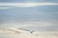 Aerial view of local fishing boat and traditional fish trap with wooden floating house in the Songkhla Lake. Royalty Free Stock Photo