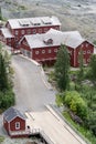 Aerial view of lodging, bunkhouses and other buildings part of abandoned mine