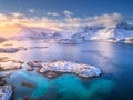 Aerial view of Lofoten islands in winter at sunset in Norway