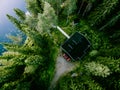 Aerial view of log cabin cottage in green summer woods by blue lake in Finland Royalty Free Stock Photo