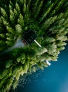 Aerial view of log cabin cottage in green summer woods by blue lake in Finland Royalty Free Stock Photo