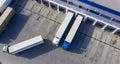 Aerial view, logistic warehouse, trucks ride near warehouse ramp