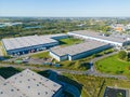 Aerial view of the logistics park with warehouse, loading hub and many semi trucks with cargo trailers standing at the ramps for Royalty Free Stock Photo