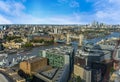 An aerial view of London, UK eastward along the River Thames towards Canary Wharf from The Shard