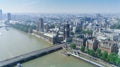 Aerial view of London with Westminster Bridge, Palace of Westminster and Big Ben being renovated in the distance. Black and White