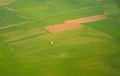 Aerial view of a lonely house among fields, agricultural parcels