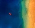 Aerial view of a lonely red boat anchored off the coast of Las Teresitas beach. Tenerife, Canaries, Spain Royalty Free Stock Photo