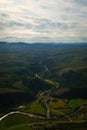 aerial view looking down green farmland, Norway