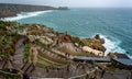 Aerial view looking down at the stage of the Minack Theatre with a stormy sea in Cornwall