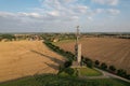Aerial view of a lookout tower at Romanka in the middle of multiple fields