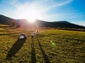 Aerial view of love couple of hikers spend time together away from city bustle by sunrise Royalty Free Stock Photo