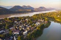 Aerial view of Luang Prabang and surrounding lush mountains of Laos. Nam Kahn River, a tributary of the Mekong River, flows